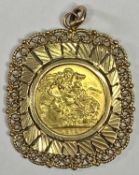 ELIZABETH II FULL GOLD SOVEREIGN - 1974, in a large 9ct gold pendant mount, 4 x 3.5cms, 15grms