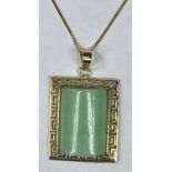 CONTINENTAL 9CT GOLD & JADE PENDANT - on fine link 9ct gold necklace, 26.5cms overall L, 23 x 20mm