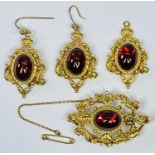 FINE 4 PIECE 9CT ENSEMBLE - scrolled oval brooch, a pair of matching earrings and a pendant, all