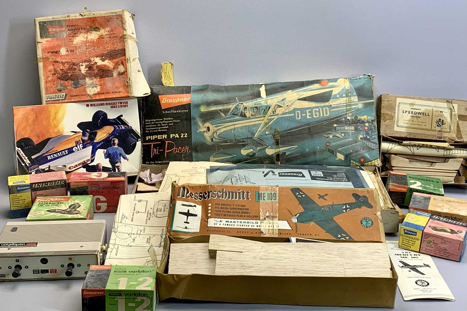 A VINTAGE GRAUPNER BOXED SCALE MODEL REMOTE CONTROL PIPER PA22 AEROPLANE - with various