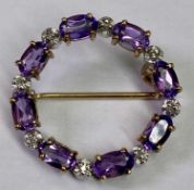 9CT GOLD AMETHYST & DIAMOND SET CIRCULAR BROOCH - the stones set alternately in yellow and white
