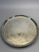 CIRCULAR SILVER TRAY - bead decoration to the rim and four supports, the centre field engraved