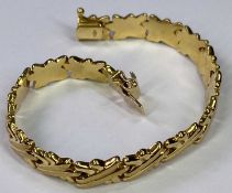 18CT GOLD '750' STAMPED POLSERA BRACELET - of double cross links with clip fastener, 20cms overall L