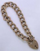 9CT GOLD CURB LINK BRACELET WITH PADLOCK CLASP - all links marked, approx 36cms L, 12.5grms
