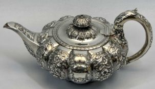 SILVER TEAPOT - of squat pumpkin form with floral and shell embossing, leaf decorated handles and