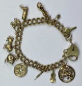 9CT GOLD DOUBLE LINK CHARM BRACELET - with padlock clasp and 11 charms, 23.2grms gross