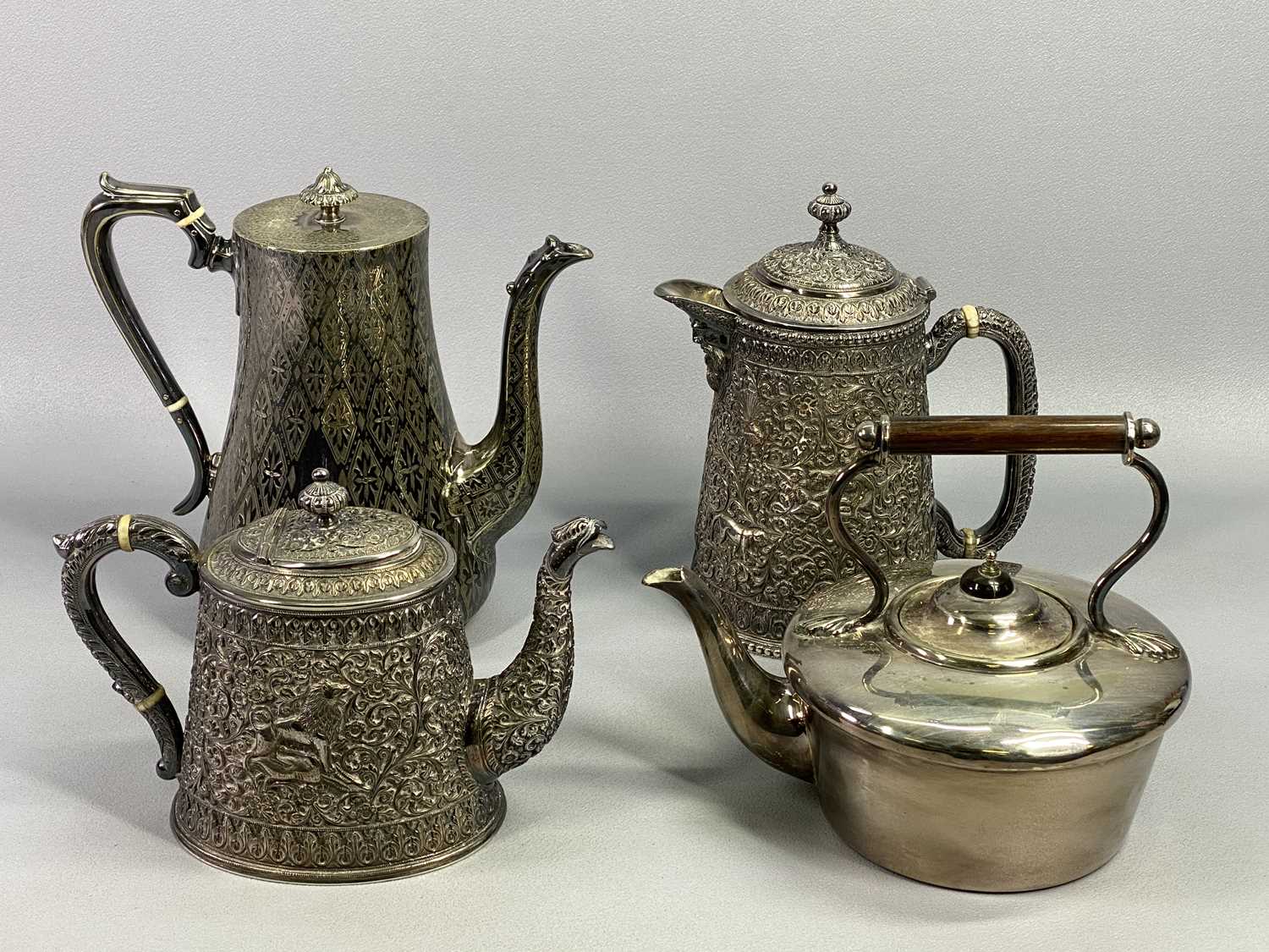 BURMESE STYLE WHITE METAL TEAPOT - repousse chased design with animals hunting, scrolls and flowers,