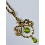 18CT GOLD SEED PEARL DECORATED PENDANT with two peridot drops, one hexagonal framed and the other