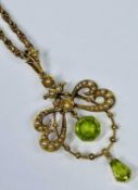 18CT GOLD SEED PEARL DECORATED PENDANT with two peridot drops, one hexagonal framed and the other