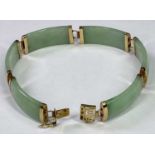 CONTINENTAL 9CT GOLD SIX SECTION JADE BRACELET - 19cms overall L open, Import Duty marks stamped '