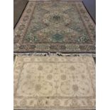 RUGS (2) to include a fine large multi-pattern border and coloured rug with central diamond and