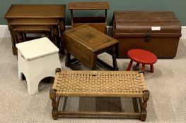 FURNITURE ASSORTMENT (7) to include string topped footstool, other footstools, metal trunk, nest