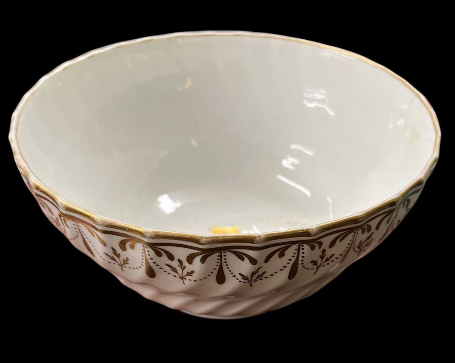 Two 18th century ribbed Worcester bowls, one with gold floral decoration to border