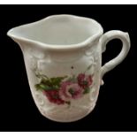 A 19th century hand painted Coalport milk jug with flower decoration