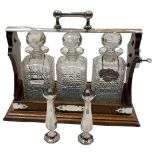 Oak Mounted 3 Decanter Tantalus with Silver Decanter Label. (5)