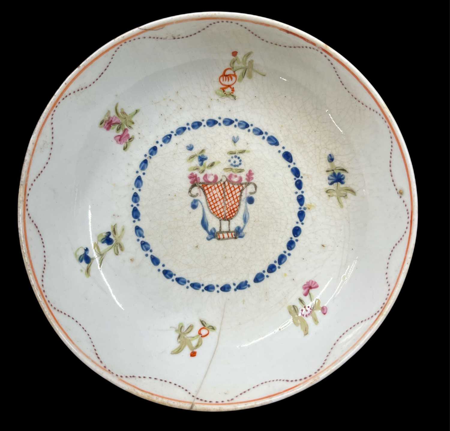 An 18th century English porcelain saucer by Newhall, with a dotted purple border