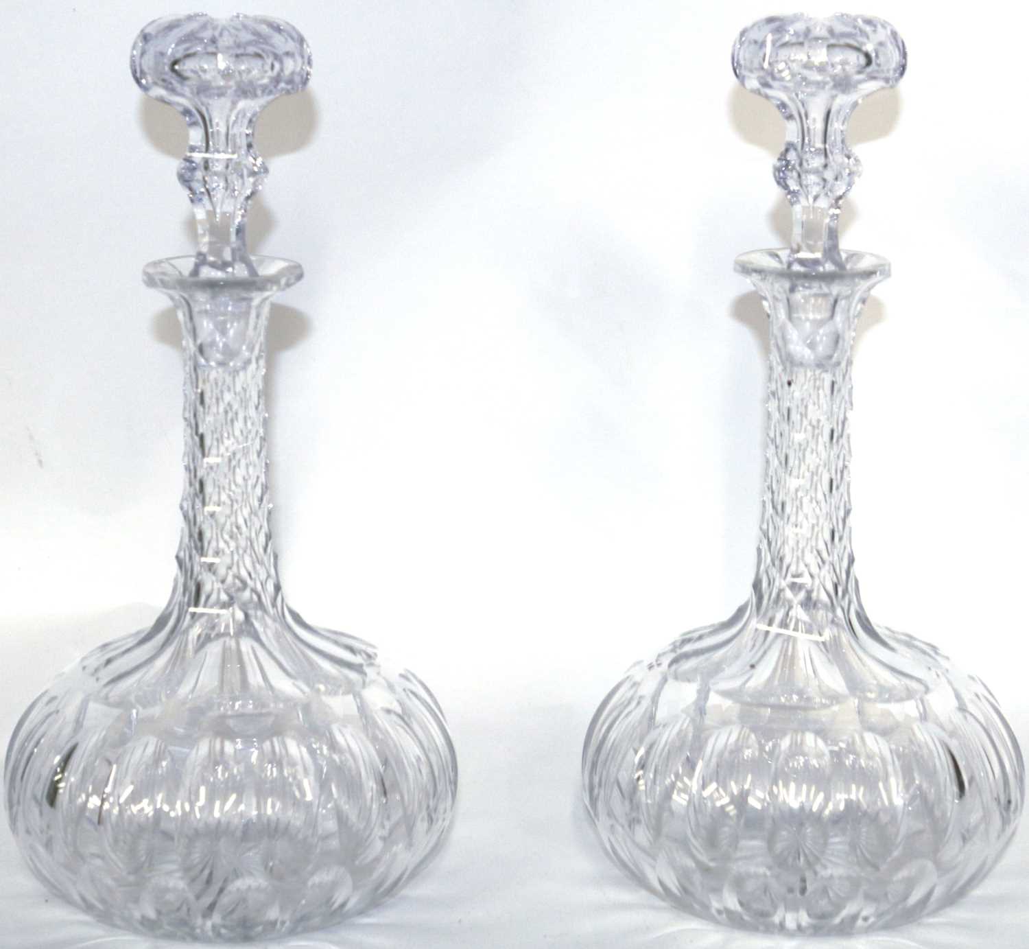 A pair of globe and shaft decanters