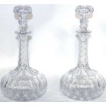 A pair of globe and shaft decanters