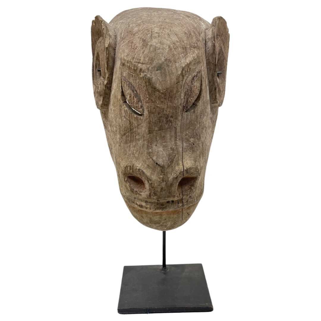 A Carved Wood Tribal Mask of a Cow,