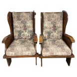 A Pair of 1920's Arts and Crafts Style Oak Framed Armchairs