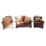 A Brown Leather Three Piece Suite