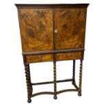 An 18th Century and later walnut cabinet on stand