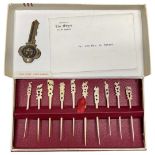 An Early 20th Century Set of Ten Carved Ivory Tooth Picks in Original Box