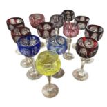 A Set of Eleven Hand Cut Coloured Bohemian Harlequin Hock Glasses, Mainly Red