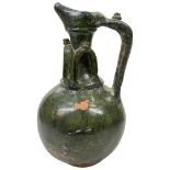 An Umayyad green glazed pottery ewer, Syria, 8-9th century