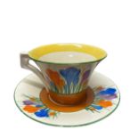 A Clarice Cliff Daffodil Shaped Teacup and Saucer in Autumn Crocus
