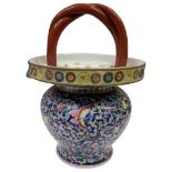 A Chinese blue enamel ground famille rose decorated porcelain basket vase