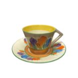 A Clarice Cliff Open Conical Handled Teacup and Saucer in Autumn Crocus