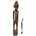 A 20th Century Nigerian Yoruba Carved Wooden Female Figure