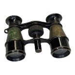 An early 20th century pair of black finished brass opera glasses