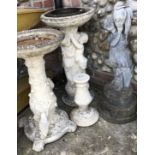 A Mixed Lot of Stone Birdbaths and a Woman Holding an Urn