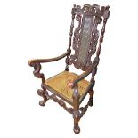 An Victorian Carved Oak Cane Backed and Cane Seated Armchair
