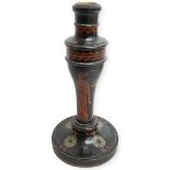 A Treen Candlestick painted in Black with Red figures