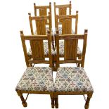 Solid Oak Set of 6 chairs with patterned seats together with a Solid Oak Oval Table with Leaf