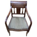 A Biedermeier Mahogany Armchair with Serpentine Shaped Seat Rail and gently cabriole-d legs.