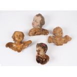 Vier Putti. Holz geschnitzt, teils