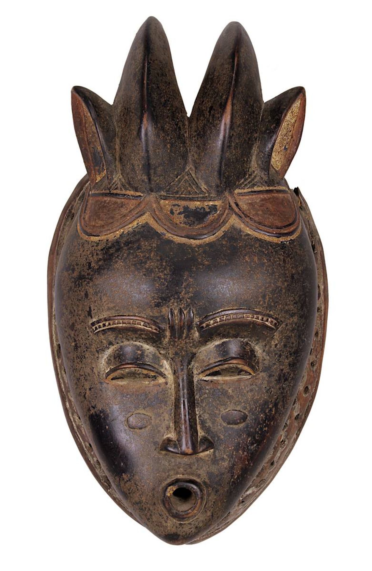 Anthropomorphe Maske der Guro oder Baule, Cote d'Ivoire, Holz geschnitzt, partiell dunkel bemalt und