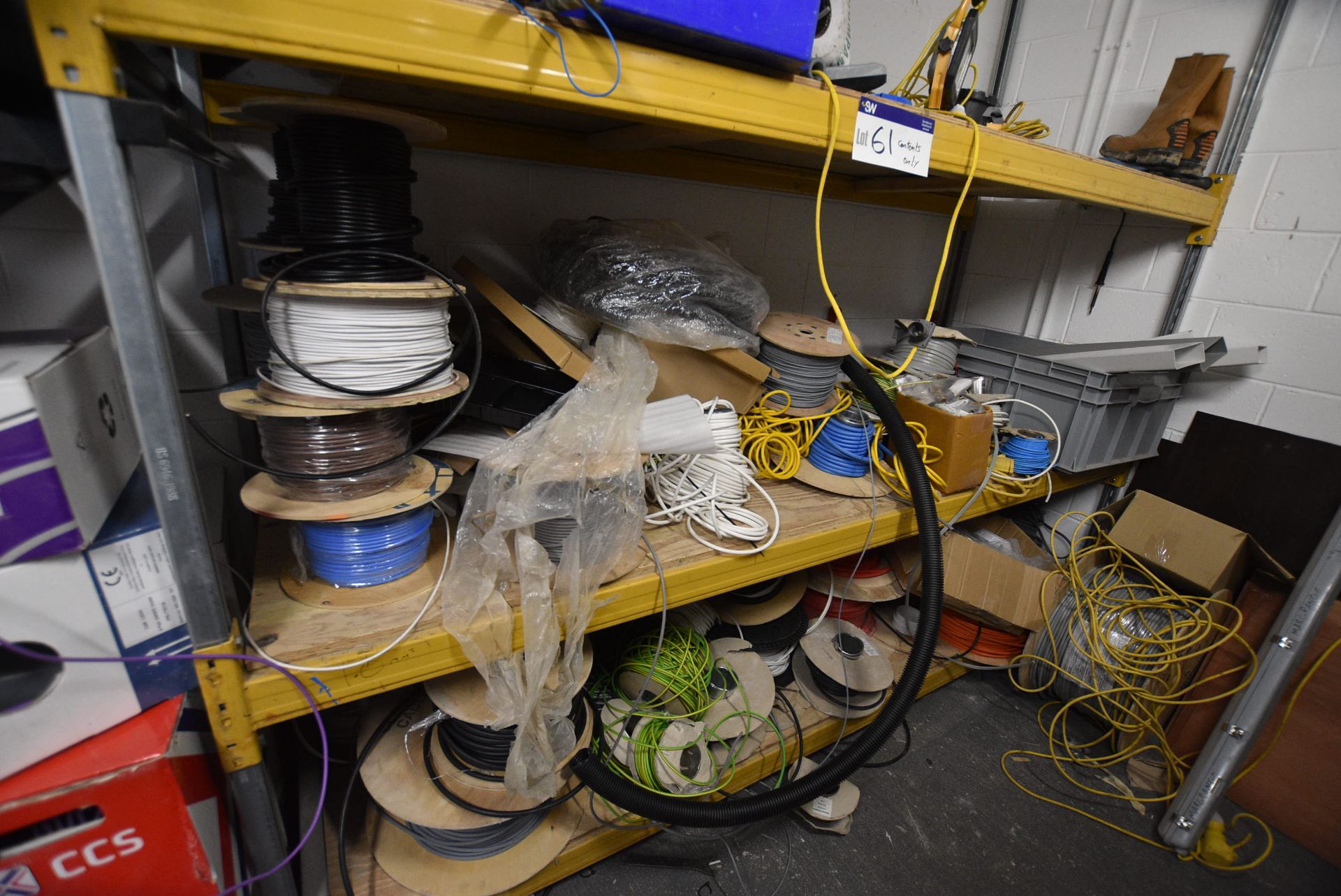 Contents of Single Bay Three Tier Pallet Rack, including mainly assorted electrical cablePlease read