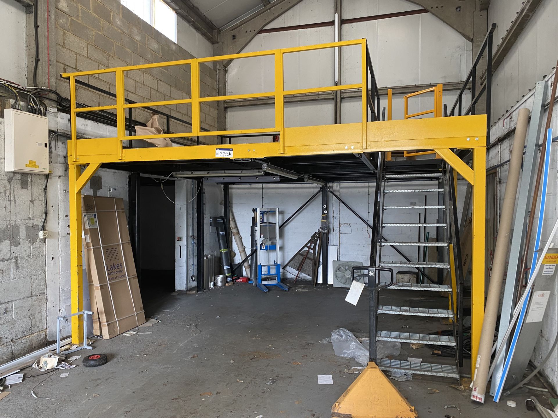 BOLTED SECTIONAL STEEL MEZZANINE FLOOR, approx. 4.7m x 4.5m x 2.4m high, with ten rise steel