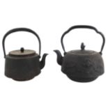 Two Japanese Iron Lidded Tea Kettles