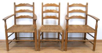 2 Armlehnstühle und 1 Stuhl, um 1900, Buche, Sitz mit Binsengeflecht, offene Armlehnen, Rückenlehne