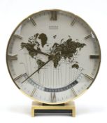 Weltzeituhr "Kienzle chronoquarz", 70er Jahre, Messing, Ziffernblatt mit Darstellung einer Weltkart