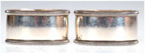 Paar Serviettenringe, 925er Silber, punziert, ca. 76 g, oval mit relefierter Rand