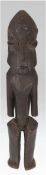 Ahnenfigur, Uganda, figürlich, Holz geschnitzt, braun gefaßt,  kl. Schwundriß, H. 38 cm