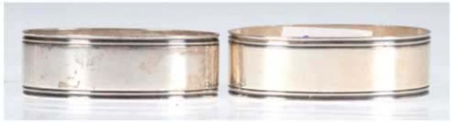 Paar Serviettenringe, 830er Silber, punziert, ca. 32 g, ovale Form mit Rillendekor