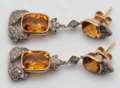 Ohrringe, GG 750, 12,2 gr., Citrine zus. 12,48 ct. mit exquisitem Schliff und Brillanten zus. 0,75 